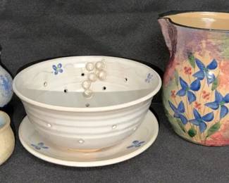 collection of handmade ceramic and studio pottery pieces, including pitchers, a small bowl, and More