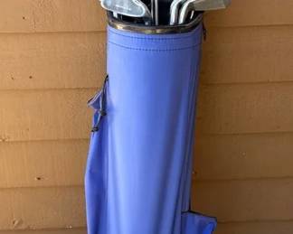 Golf Clubs With A Blue Carry Bag