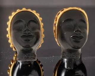 PAIR OF MID‑CENTURY FIGURAL FLORENZA HEAD FINIALS