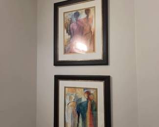 Pair of framed abstract figurative prints in warm red, blue and ochre