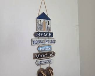 Distressed wood Beach House Rules arrow sign with wood flip-flops