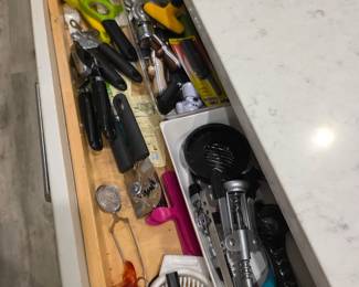 Kitchen gadget drawer with lever corkscrew, shears and can openers