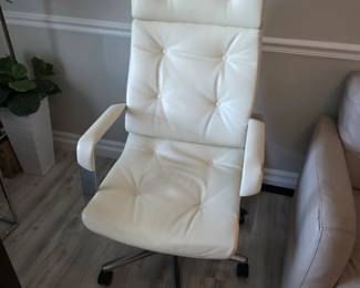 White tufted faux leather high-back swivel office chair with chrome base