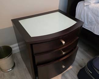 Matching espresso bow-front nightstand with brushed nickel pulls