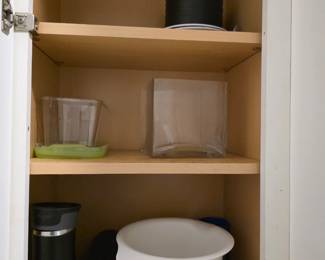 Clear square glass vase, white salad bowl, stockpot and food storage