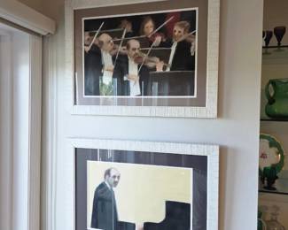 Two silver-framed prints of tuxedoed violinists and pianist at grand piano