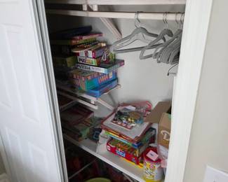 Board games, jigsaw puzzles and kids' craft kits with white hangers