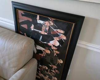 Large black-framed print of tuxedoed violinists with gold liner