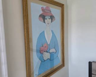 Framed print of stylized woman in pink cloche hat holding red flowers