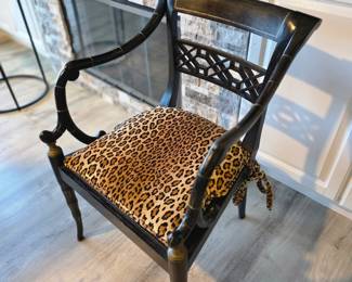 Regency-style ebonized faux bamboo armchair with fretwork back and cushion