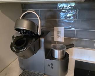 Single-serve pod coffee maker with stainless steel milk frother
