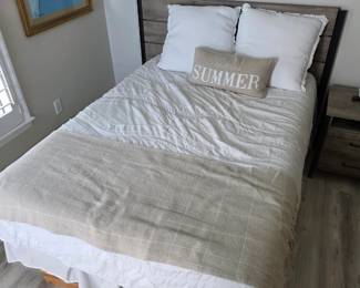 Gray rustic plank headboard bed with white bedding and Summer pillow