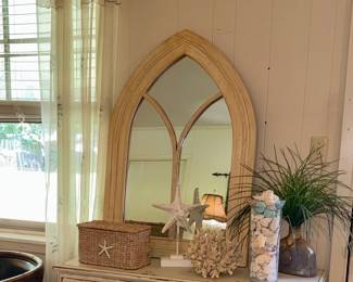 Arched mirror and coastal treasures