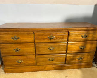 Lot 104: Wooden Nine-Drawer Dresser - located on 2nd floor. Bring help to move