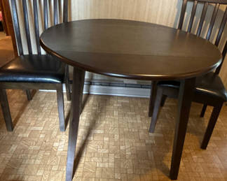 Lot 114: Dark Wood Drop-Leaf Dining Table and Two Chairs