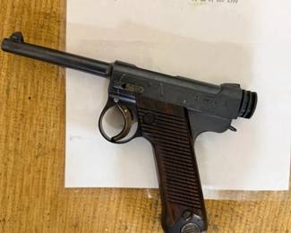 Nambu pistol, other side, with letter.