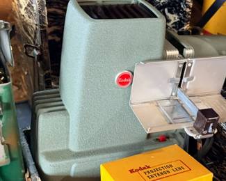 Vintage movie projector and film supplies