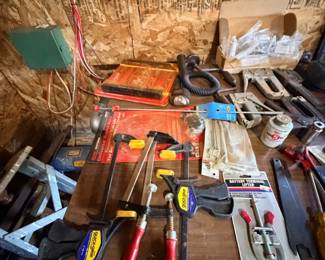 Assorted hand tools and workshop supplies