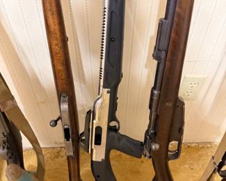 Hi-Point 995 9mm carbine (center).