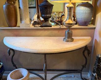 stone Demi-lune entry table, iron duck-head legs