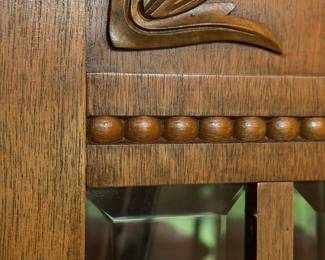 note beveled glass on cabinet door