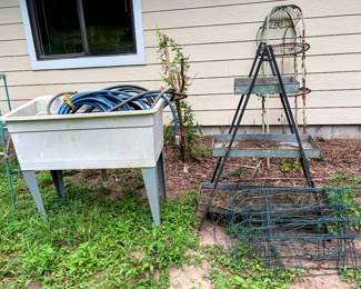plastic sink, hoses, garden racks