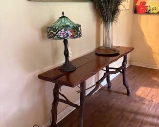 twig foyer/sofa table, stained glass lamp, peacock feathers