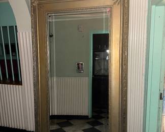 Enormous 7’ tall gilded mirror. Bring help to move it if you want it.