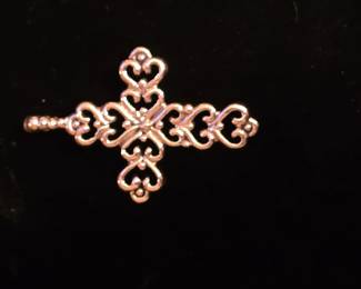 14K.  One of the many nice Gold crosses in this sale. 