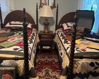 High poster twin beds.  Twin size quilted quilts 