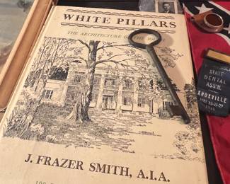 White pillars book.  Old metal jail key 