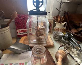 Daisy glass churn , milk bottles , wood implements etc 