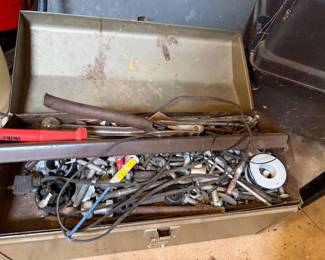 Metal toolbox filled with bolts, fasteners, a Weller soldering tool and solder