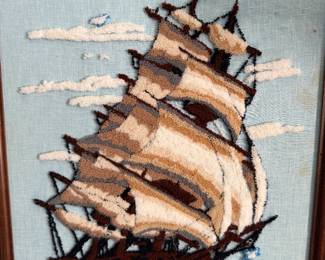 Framed crewel embroidery of a tall ship under sail