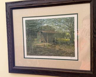 Framed and matted signed print of a rustic log barn