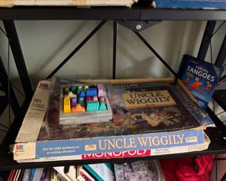 Uncle Wiggily game, Monopoly, Travel Tangoes and a tray of building pieces