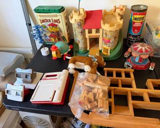 Lincoln Logs, Fisher-Price castle, Tinkertoy set, View-Masters, a tin carousel and wooden blocks