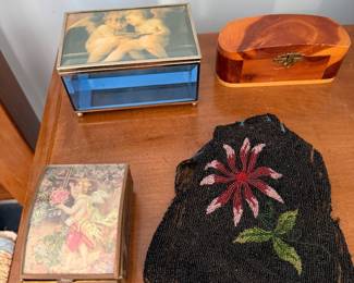 Two cherub decorated glass trinket boxes, a cedar box and an antique beaded purse with floral beadwork