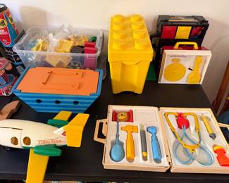 Fisher-Price airplane, Noah's Ark toy, Lego storage brick, Fisher-Price record player and toy doctor and tool kits