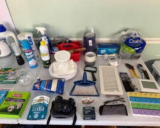 Household goods including cleaning supplies, binoculars, pruning shears, pill organizers and a vent cover