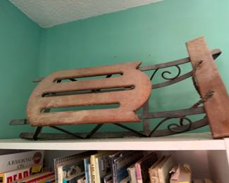 Antique wood and wrought iron child's sled with scrolled runners