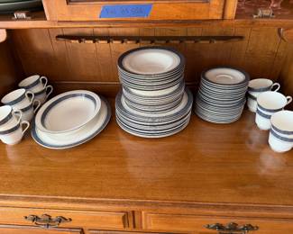 Large set of blue and gold banded china, plates, bowls, cups, saucers and platter