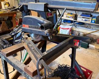 Craftsman radial arm saw on a metal stand