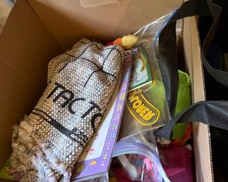 Box of children's games including a woven tic tac toe mat