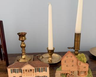 Brass candlesticks and chamberstick with two miniature village buildings, a colonial house and a grist mill