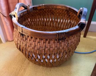 Large round woven splint basket with leather handles