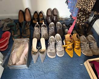 Women's shoe collection with Vionic flats, boxed heels, sneakers and sandals
