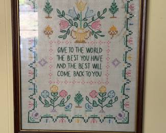 Framed cross stitch sampler with floral border and motto