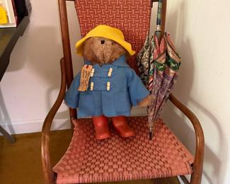 Paddington Bear plush on a bentwood rocking chair with woven seat