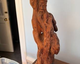 Carved root wood sculpture of a Chinese elder figure on a wood base